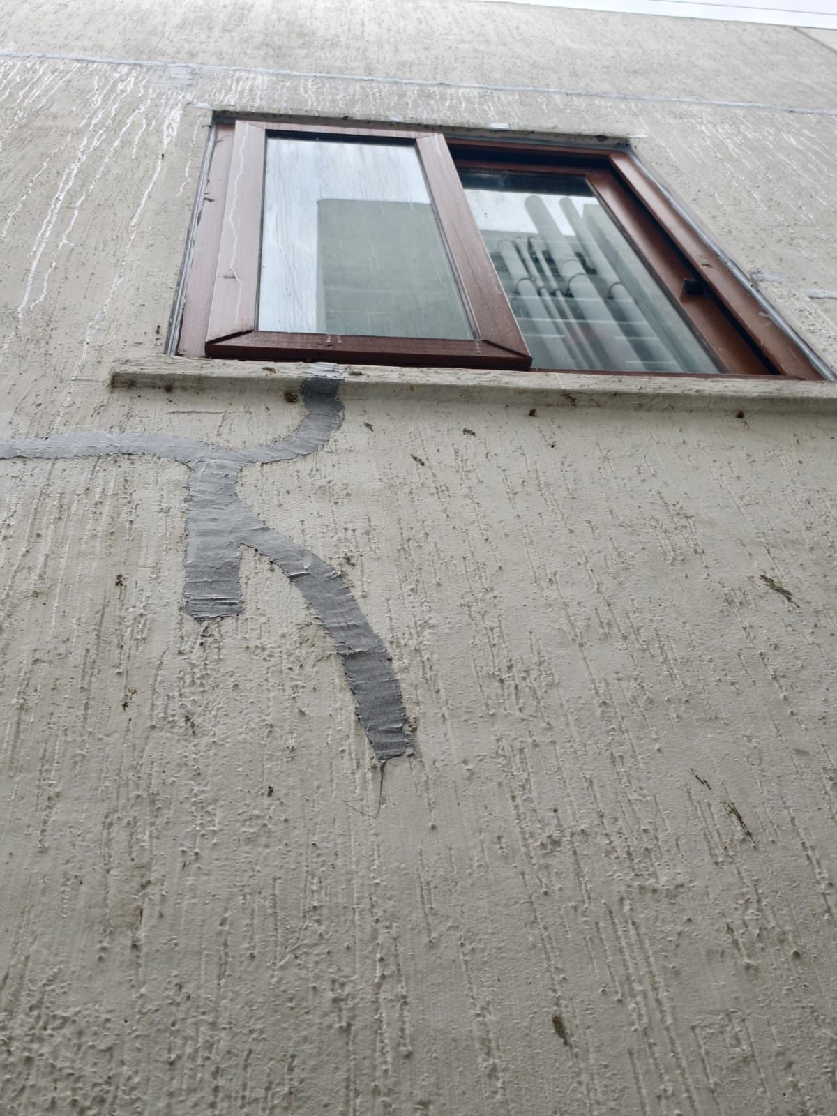 Exterior wall after PU sealant waterproofing treatment at Kannamangala