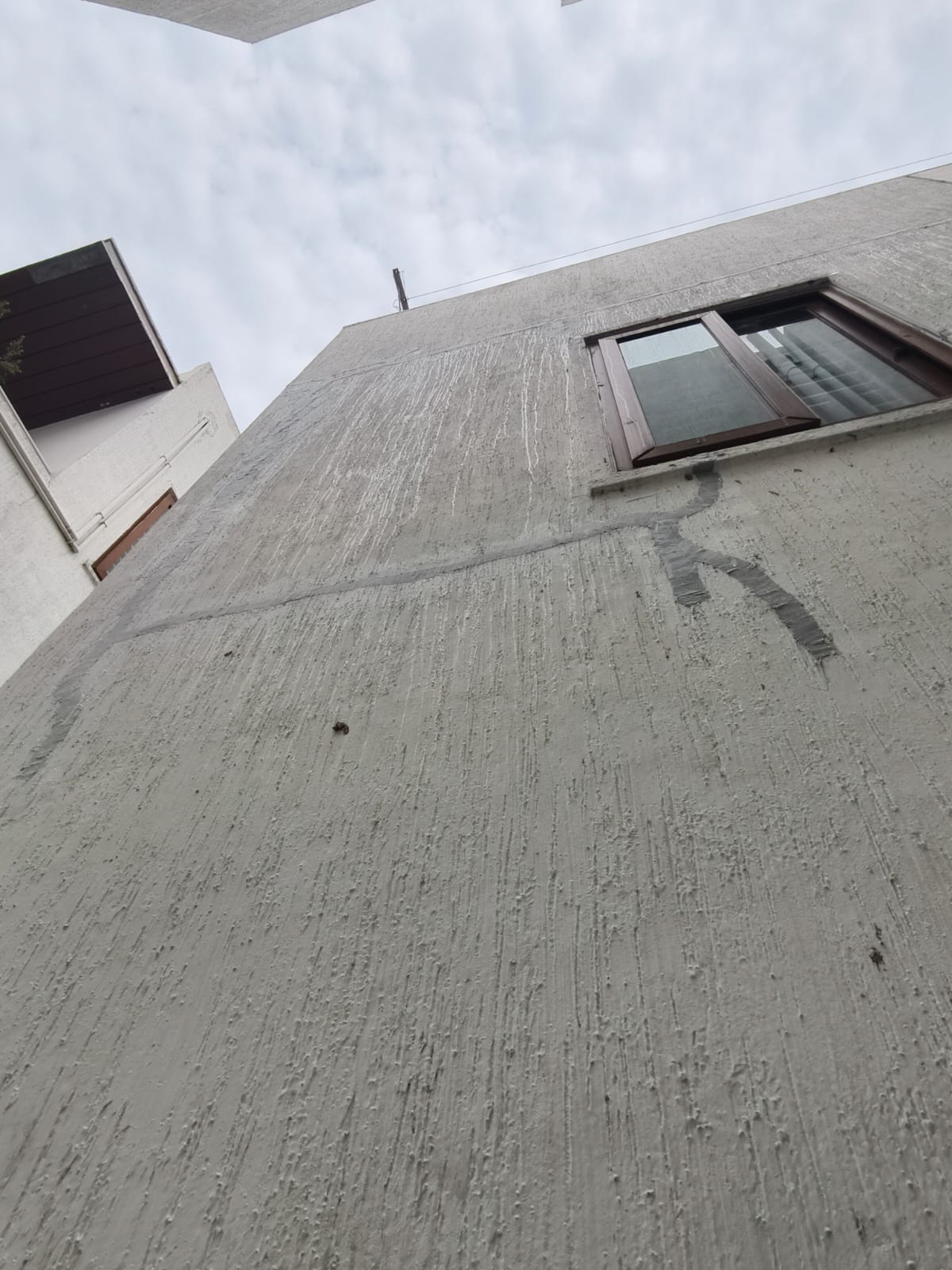 Full exterior wall after waterproofing treatment at Kannamangala