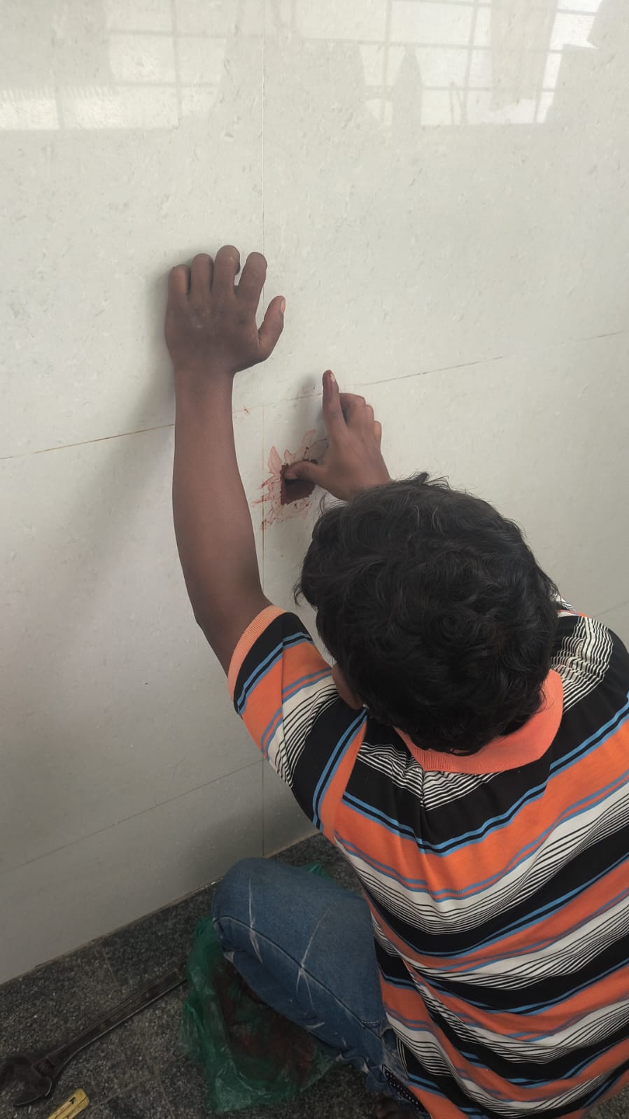 Worker showing the sealed area after injection grouting treatment