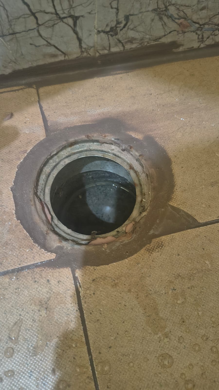 Corroded kitchen drain outlet before replacement